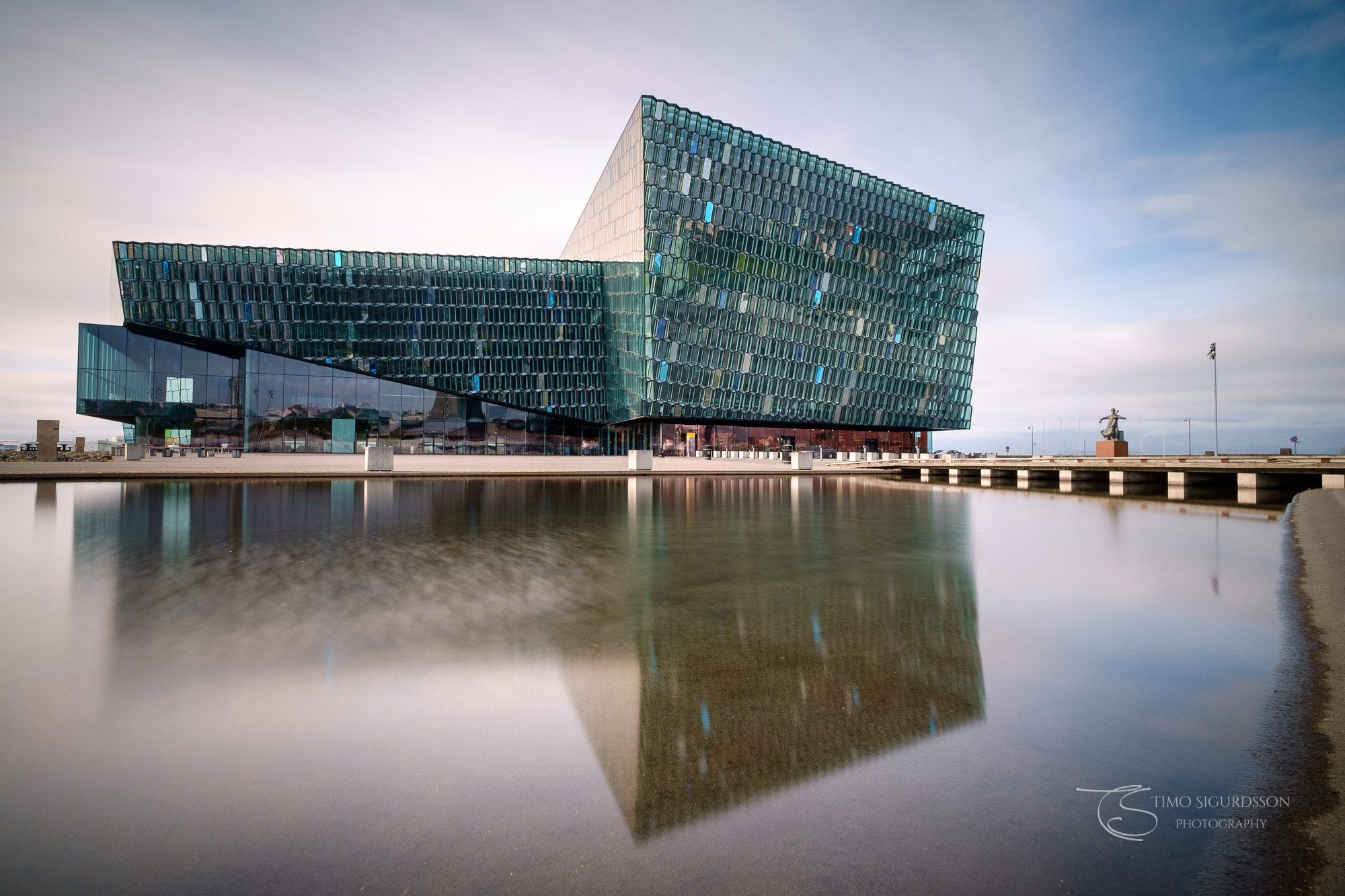 Harpa Concert Hall, Reykjavik, Icaland. Reflection in pond.