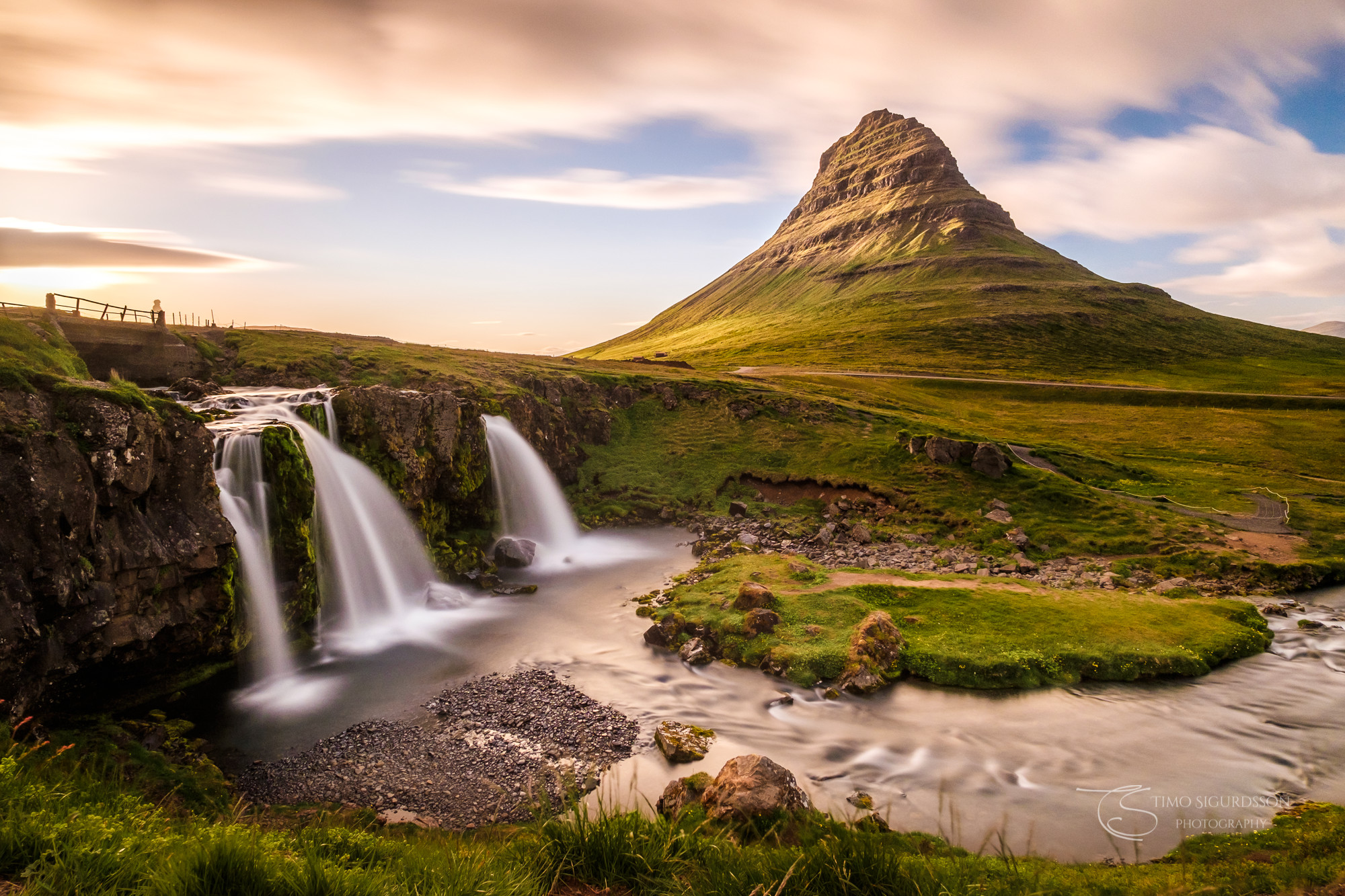 Grundarfjörður, Iceland. Kirkjufell mountain behind Kirkjufellsfoss waterfalls at dusk.