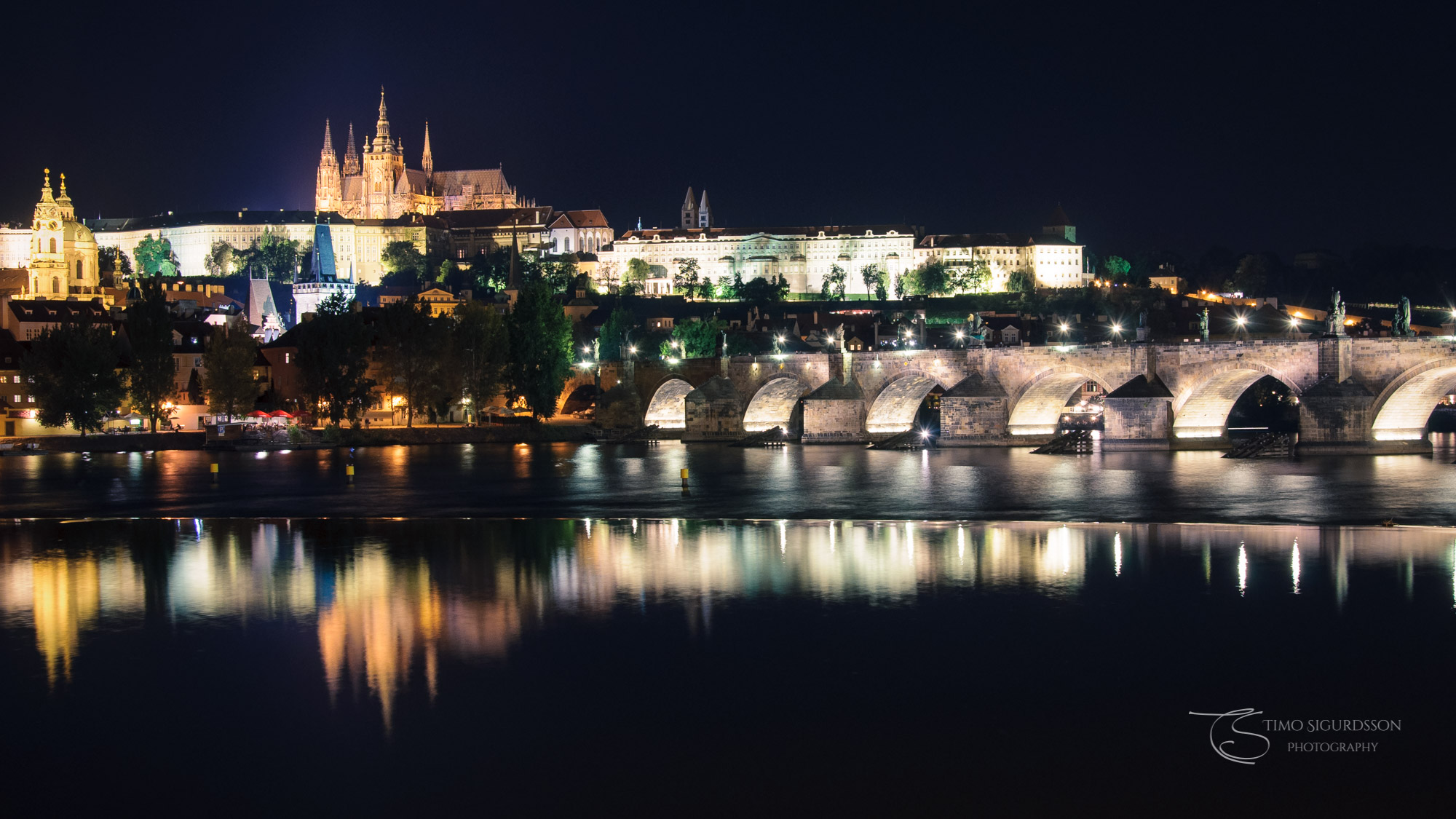 Prague | Praha, Czechia. Castle and Charles Bridge at night. River Vltava.