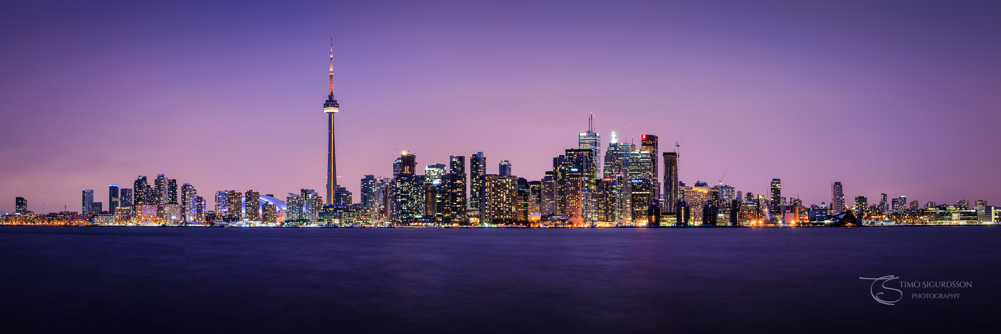 Toronto, Canada. Skyline panorama at night. Lake Ontario. Ward's Island.